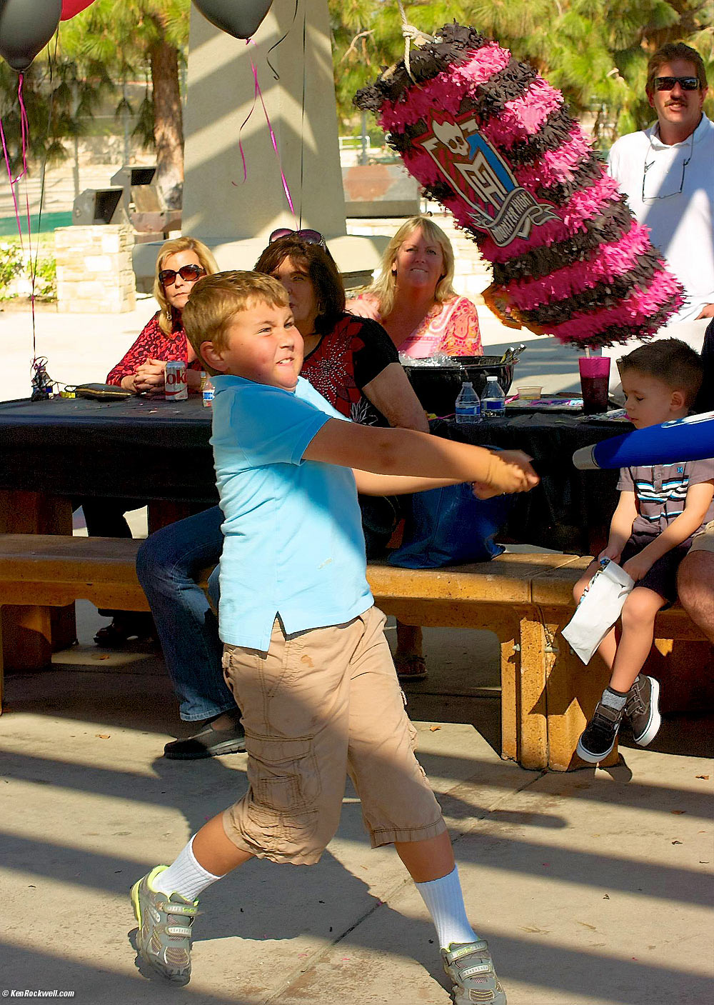 Ryan slams the Pi&ntilde;ata at Skyler's party the Dinosaur Park.