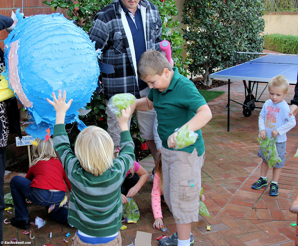 Ryan and friends share the pi&ntilde;ata candy and toys