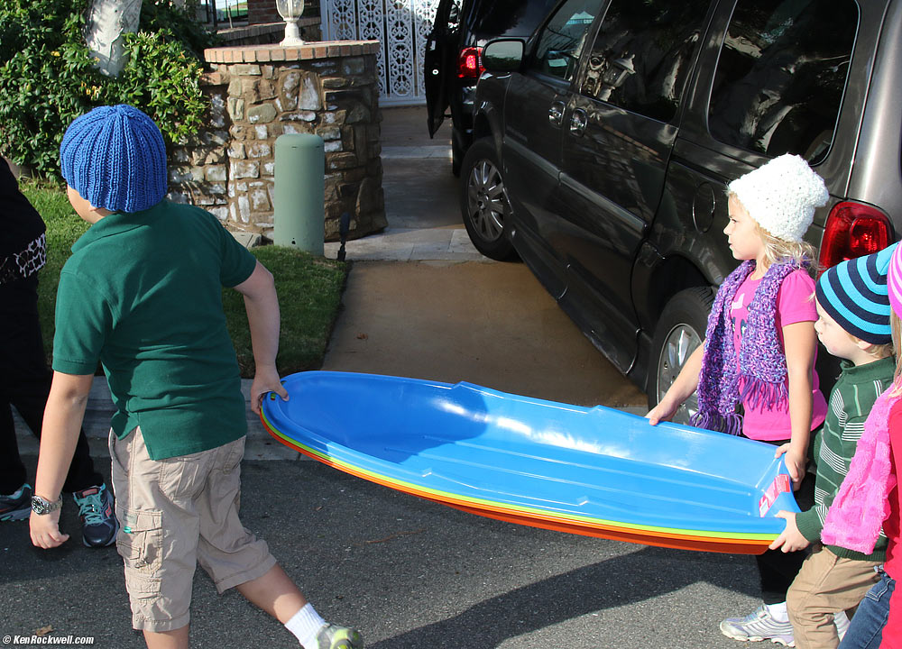 Ryan, Katie and Charlie haul the sleds to the park