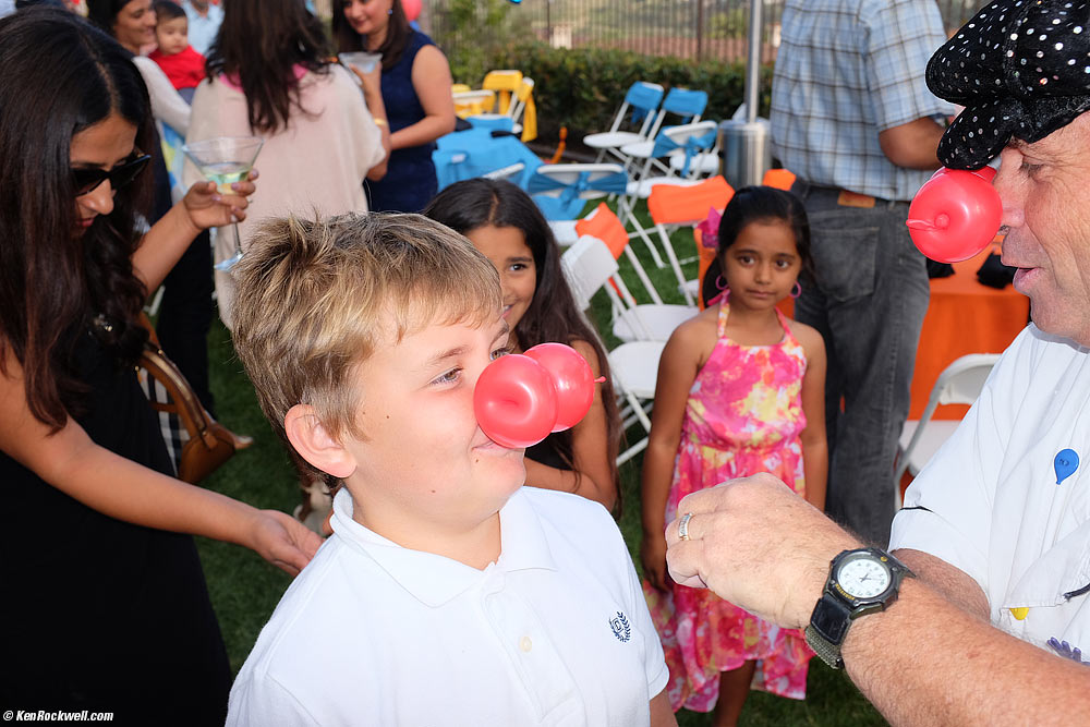 Ryan gets a funny nose from the balloon guy