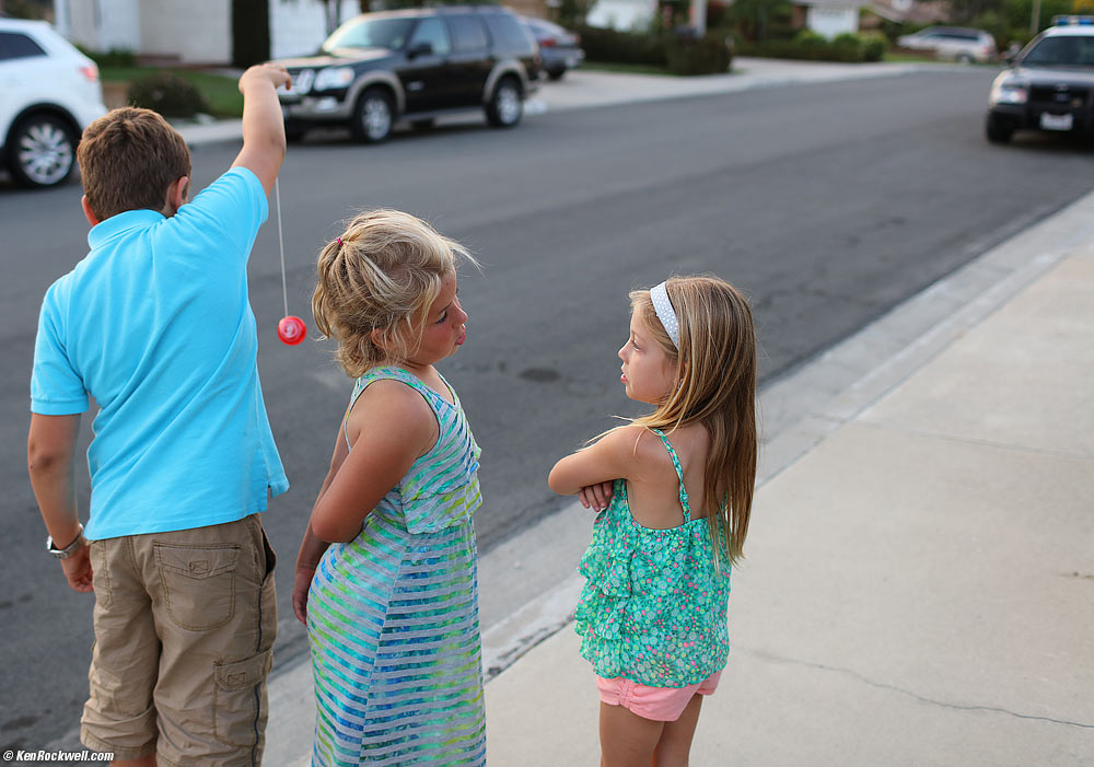 Ryan plays with his yoyo while watching an arrest