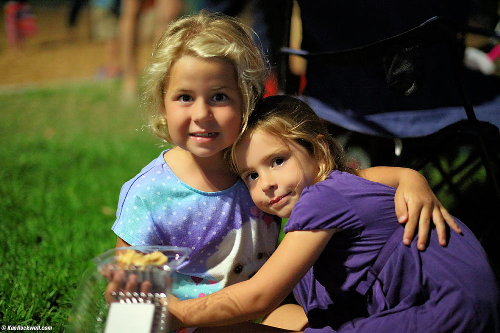 Katie and Emily, long after dark lit by park lights