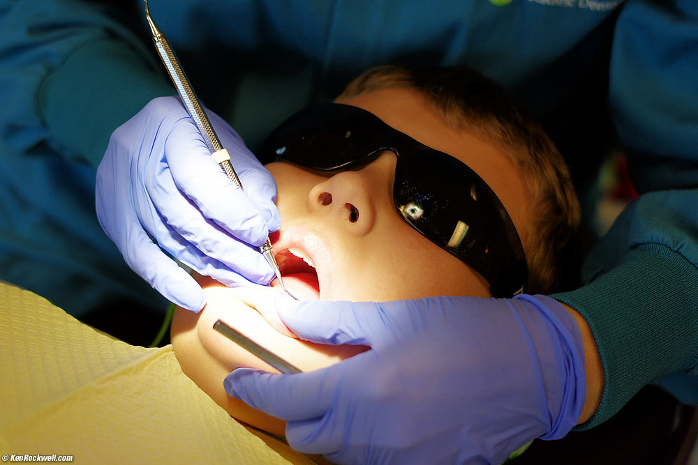 Katie behind glass at the dentist's office
