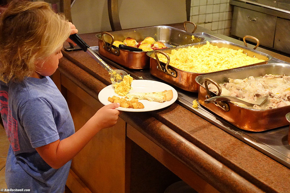 Katie getting eggs at breakfast