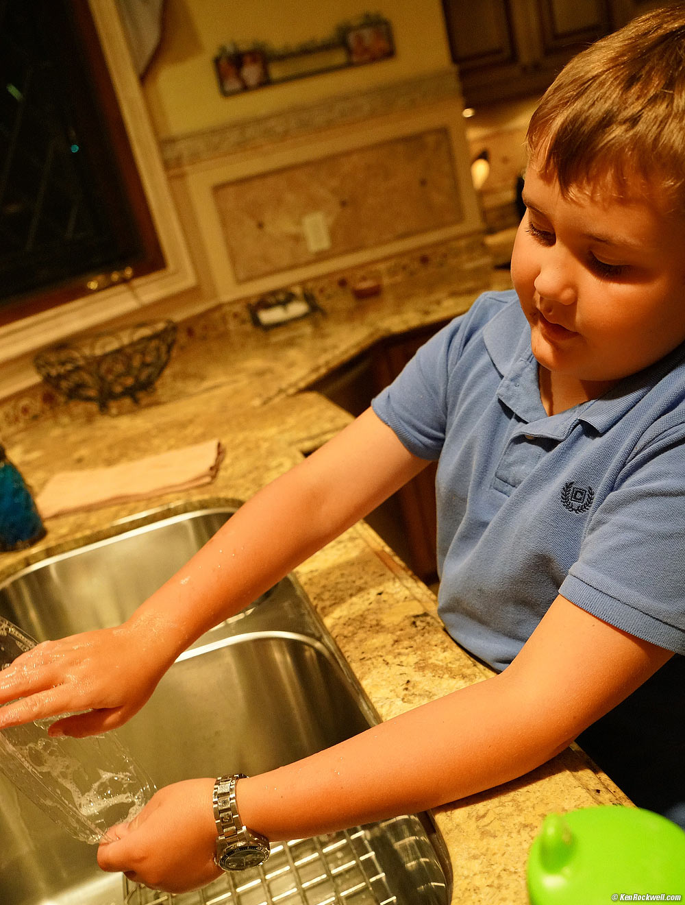 Ryan washing-out the plastic boat base from his banana split, 11 September 2015