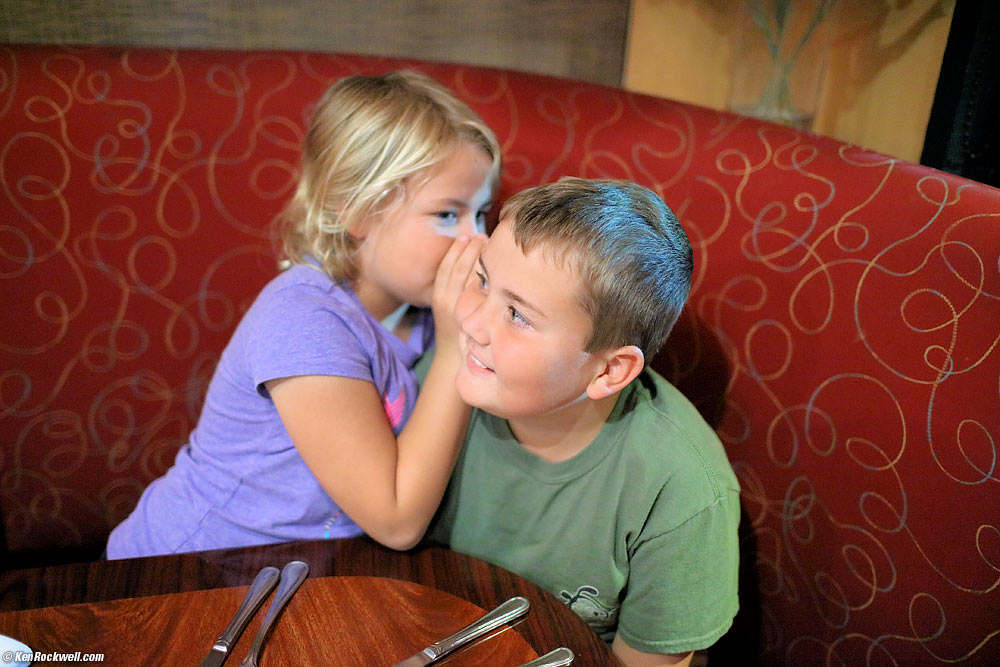 Katie whispers to Ryan at Empanada Tuesday