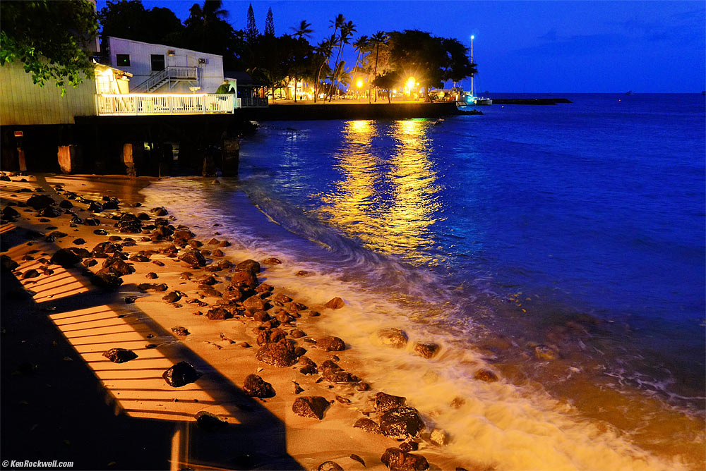 Lahaina shoreline at night with wave