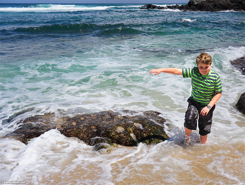 Ryan runs away from the waves