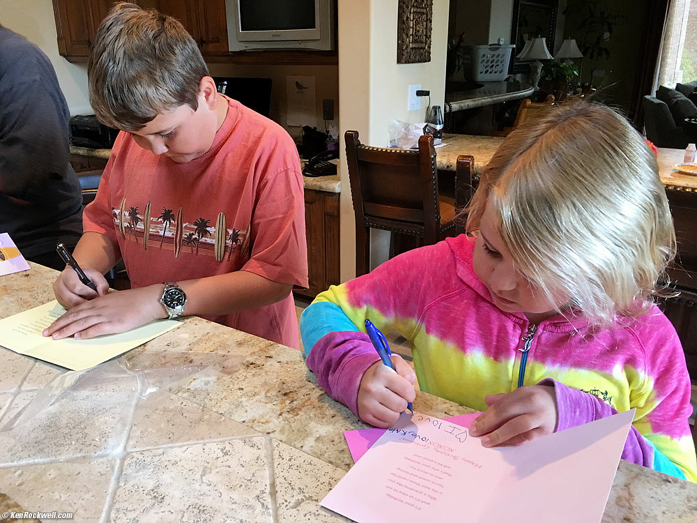 Ryan and Katie make out birthday cards to Grandma Rockwell.