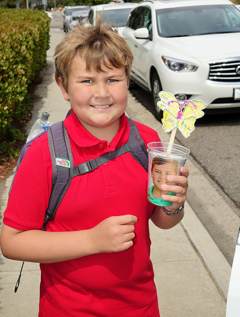 Ryan with what he made Mom at school for Mother's Day.