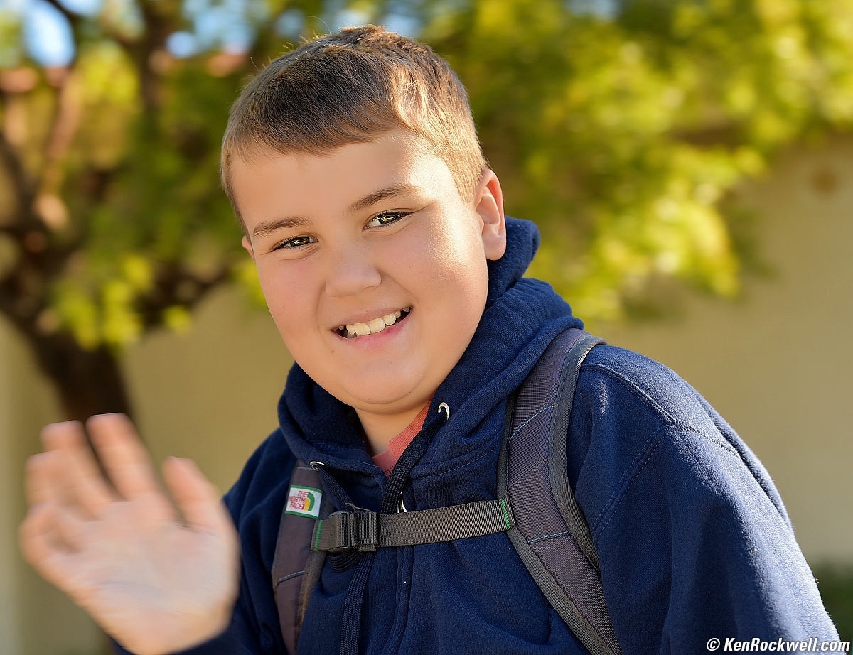 Ryan waves as he goes to school.