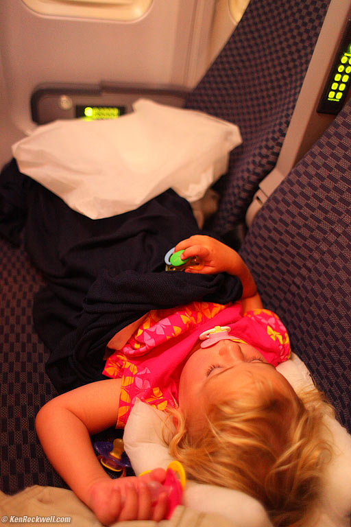 Katie asleep in dad's arms, 5:35 PM HST (8:35 PDT).