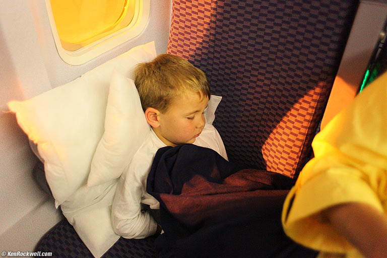 Katie asleep in dad's arms, 5:35 PM HST (8:35 PDT).