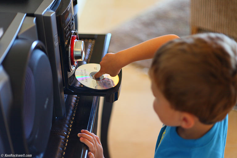 Ryan properly handling a CD, Maui. 12:23 PM.