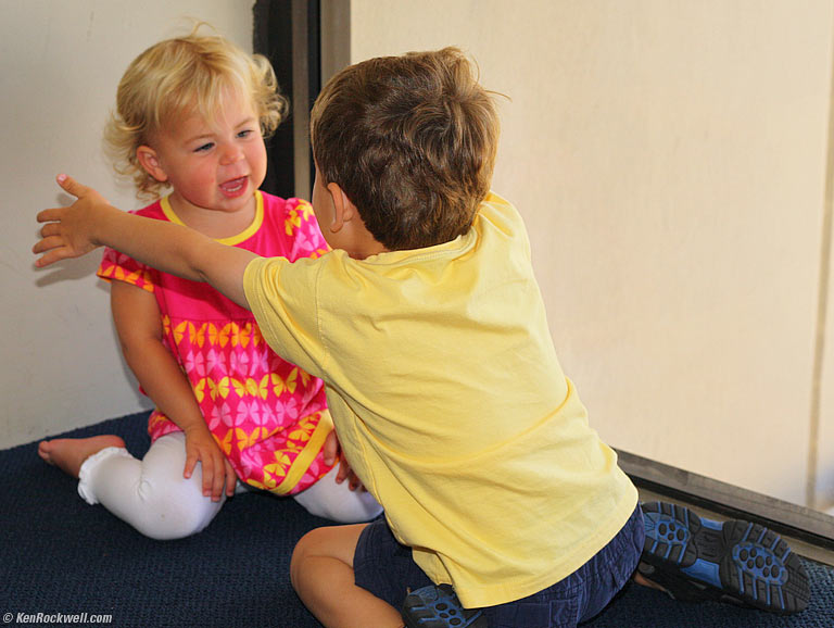 Ryan gives Katie another hug, Honolulu Airport. 12:05 PM.