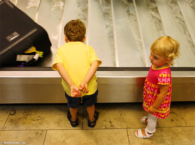 Ryan and the luggage conveyor, 9:59 PM.