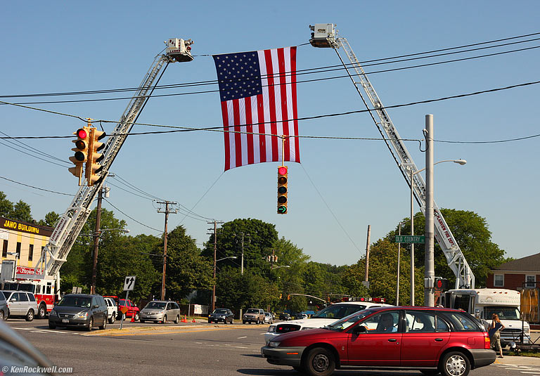 Flag and car, Old Country Road, Plainview, Long Island, 9:32 AM.