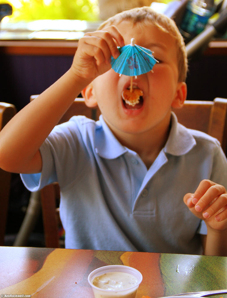 Ryan puts the froofy umbrella to good use, 11:37 AM.