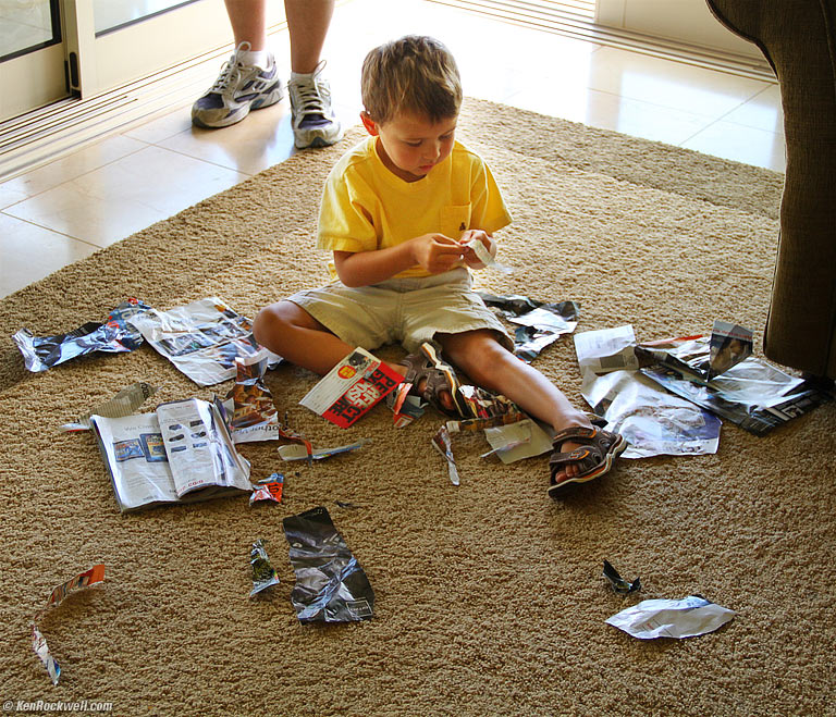 Ryan plays with Dada's Popular Photography magazine, 11:56 AM. 
