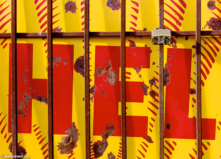 Katie helps people carry her bagHELL, 3:52 PM. (Auto ISO 160, Auto 1/90, LEICA SUMMICRON-M 50mm f/2.), 7:00 AM.