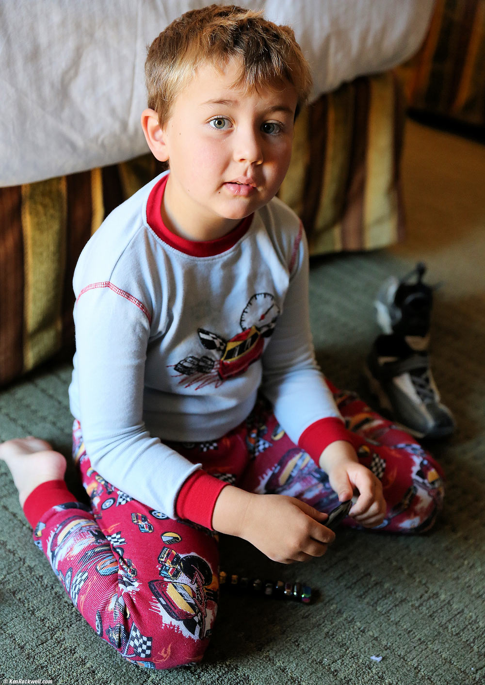 Ryan enjoys his magnetic hematite rocks gotten yesterday at the Fill The Bag at the museum, Furnace Creek Resort, Death Valley, California 6:25 AM