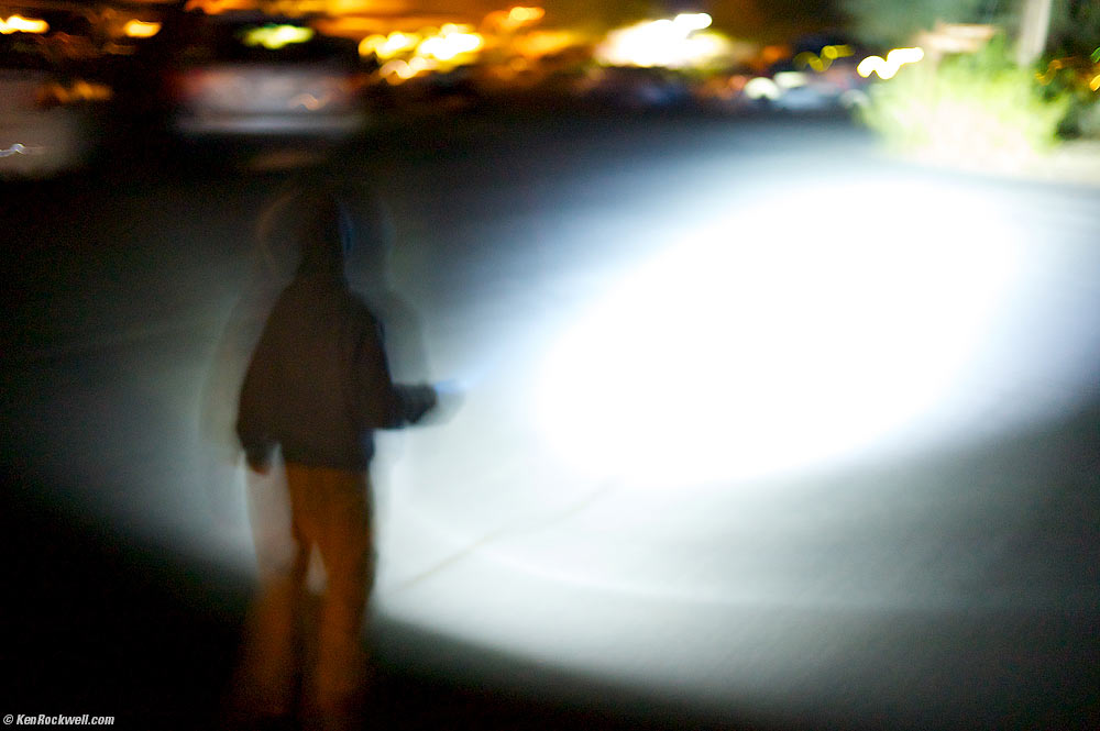 Ryan walking in the dark guided by the Super Flashlight, Furnace Creek Ranch, Death Valley, California 7:11 PM
