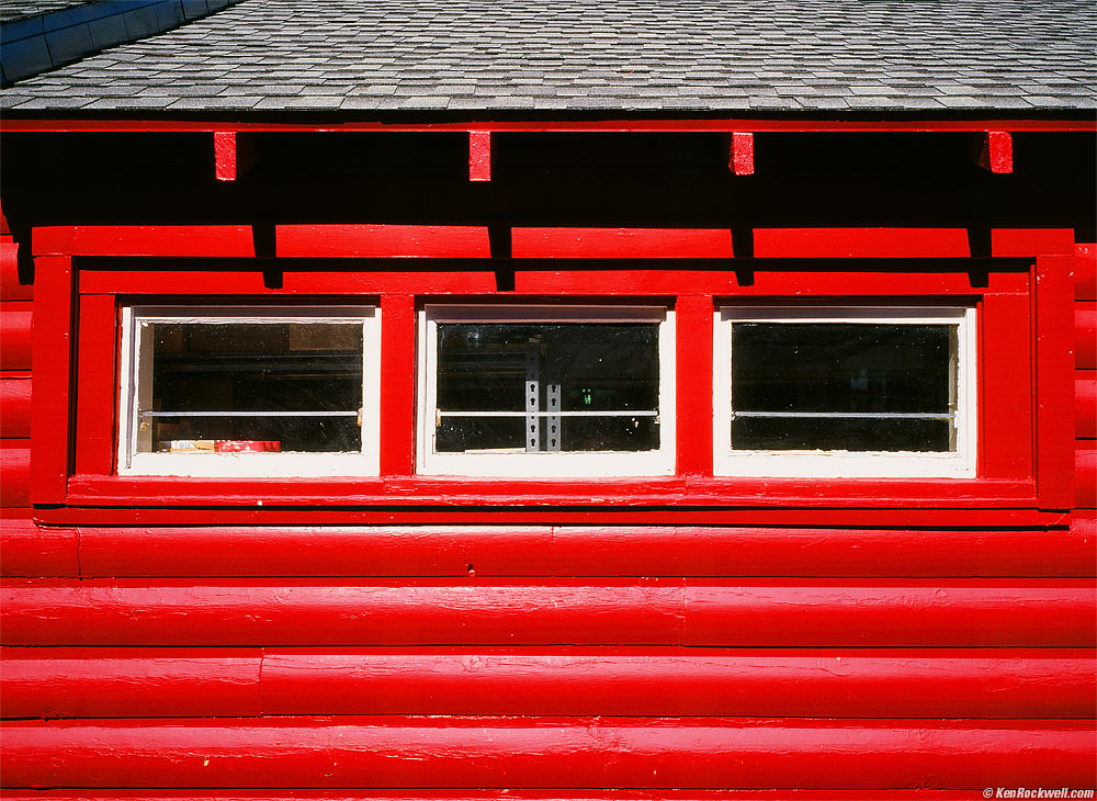 Red Log-Cabin Market with Three Windows